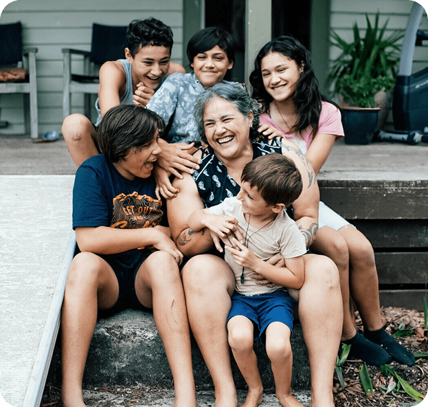 Whānau laughing together